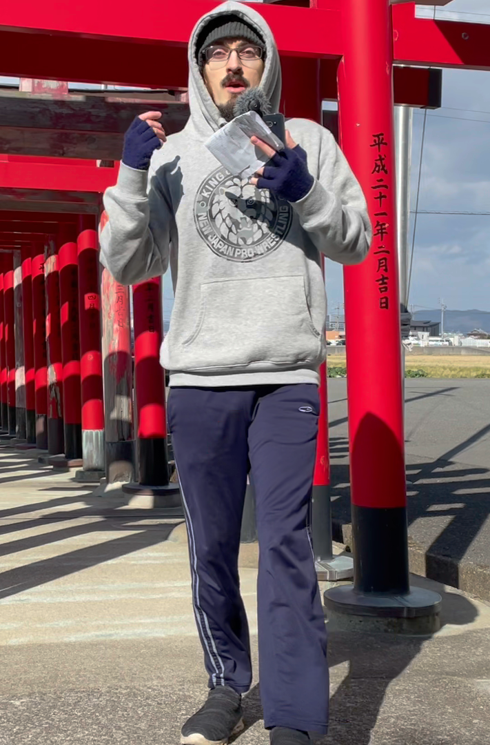 Zach vlogging at a shrine in Japan